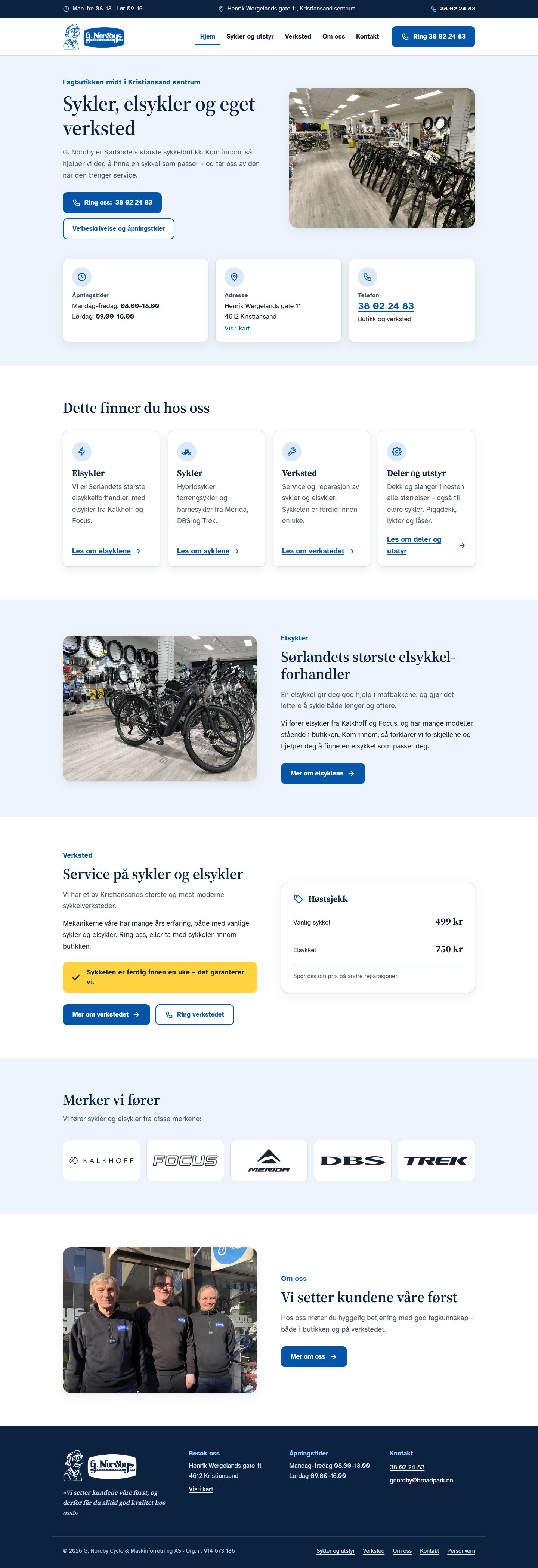 Forsiden til G. Nordby med lys, blå profil, åpningstider øverst og merkene butikken fører